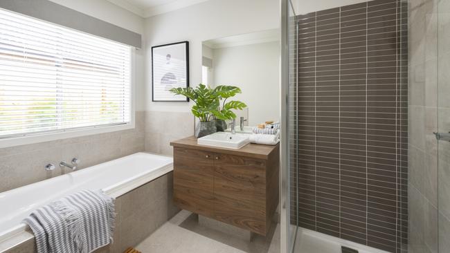 The family bathroom includes a bath, single vanity and shower.