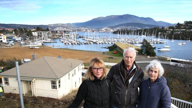 Bellerive residents Cheryl Davison, left, with Michael and Anne Geard in front of the Kangaroo Bay development site in 2017. Picture: SAM ROSEWARNE.