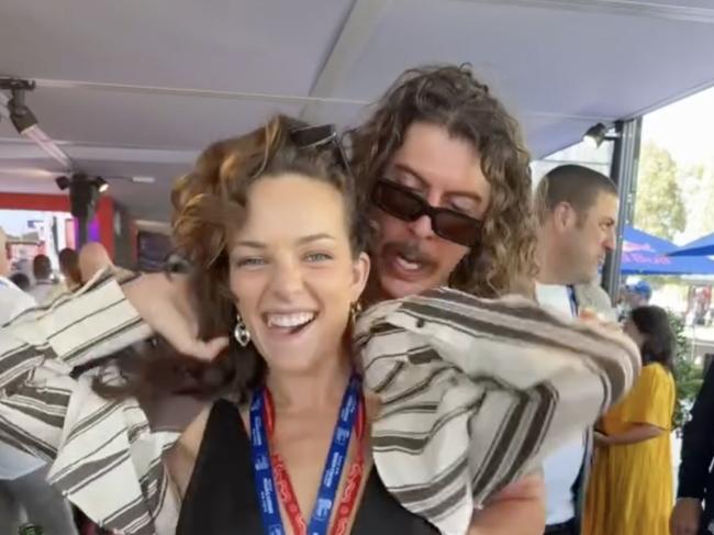 Abbie Chatfield with Peking Duk's Adam Hyde at the Melbourne Grand Prix. Picture: Instagramhttps://www.instagram.com/p/C44w9MGPpTM/?hl=en&img_index=1