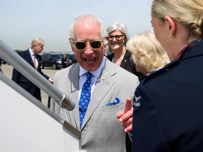 Britain's King Charles III gestures before boarding his plane at Sydney Airport. Picture: AFP