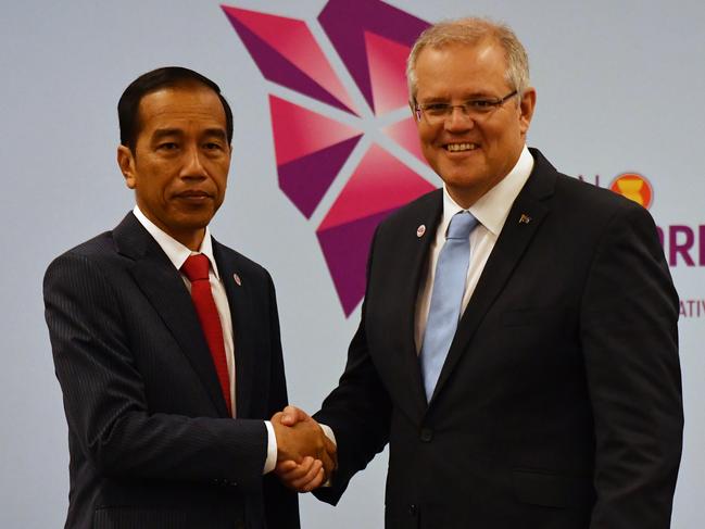 Australia's Prime Minister Scott Morrison and Indonesia's President Joko Widodo at a bilateral meeting during the 2018 ASEAN Summit in Singapore, Wednesday, November 14, 2018. (AAP Image/Mick Tsikas) NO ARCHIVING