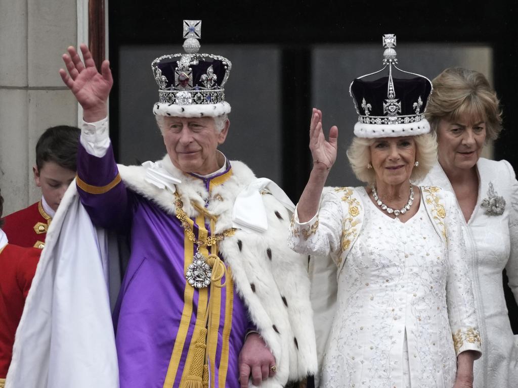 King Charles III and Queen Camilla can be seen on the Buckingham Palace balcony ahead of the fly-past. Picture: Christopher Furlong/Getty Images