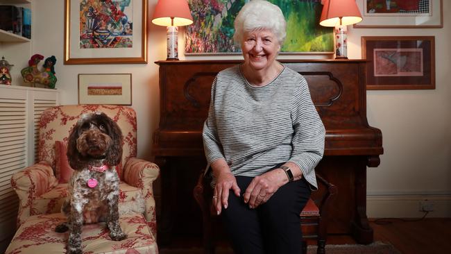 Elizabeth Butcher at home with her dog, Paisley. Picture: John Feder