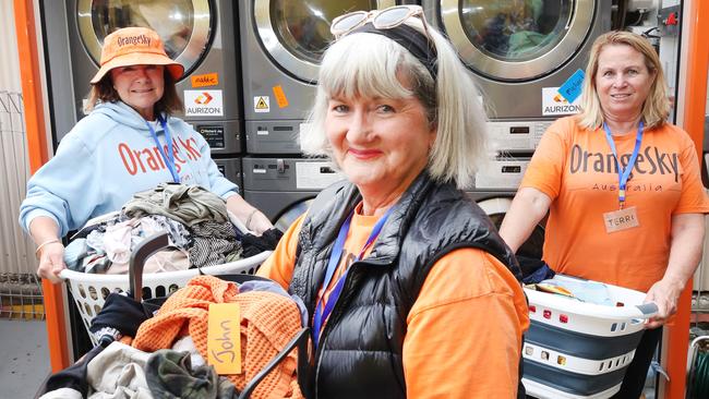 Orange Sky volunteers working at a community hub in Southport. Picture: Glenn Hampson.