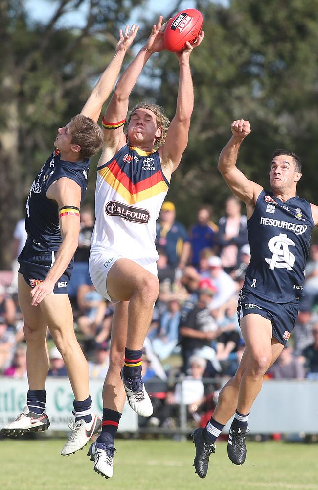 Adelaide Crows’ Harry Dear marks during the win against South Adelaide at Encounter Bay Oval.