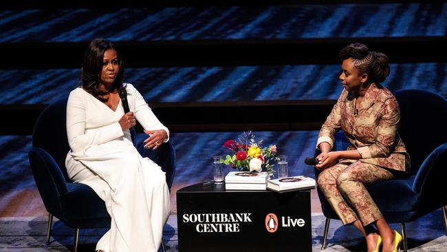 Adichie on stage with former US first lady Michelle Obama at The Royal Festival Hall in 2018. Picture: Getty