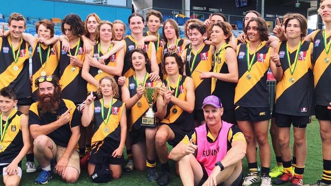 REDEMPTION: The Grafton Tigers Junior AFL under-15s celebrate their grand final win over the Sawtell Toormina Saints.