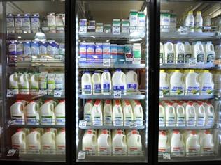 Milk on sale inside a Woolworths grocery store in Brisbane