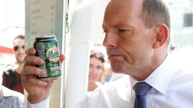 Mr Abbott said he keeps up with exercise so he can occasionally indulge when eating and drinking. Photo: Liam Kidston