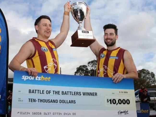 Nunawading co-captains Jordan Winter and Luke Bogdan hoist the trophy. Picture: Garry Legg