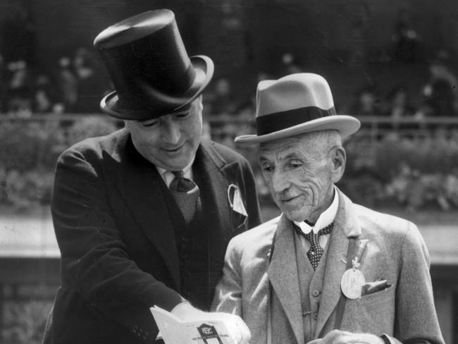 Former Prime Minister Billy Hughes discusses prospects with the federal Attorney-General, Robert Menzies, at the Derby at Flemington in the 1930s.