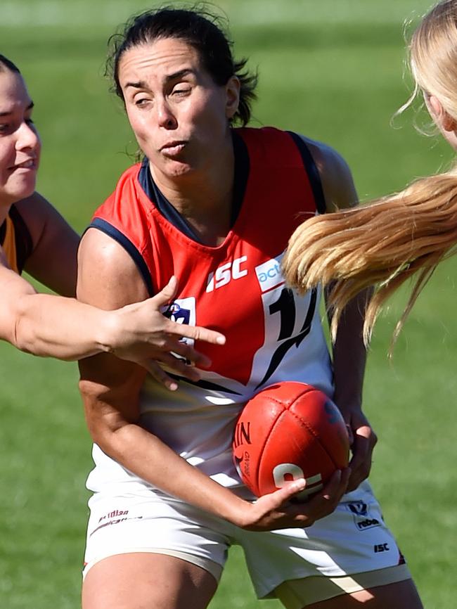 Stephanie Simpson gets a handball clear. Picture: Steve Tanner