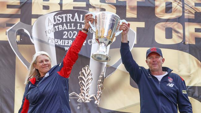 Melbourne president Kate Roffey and CEO Gary Pert lift the premiership cup. Picture: Michael Klein