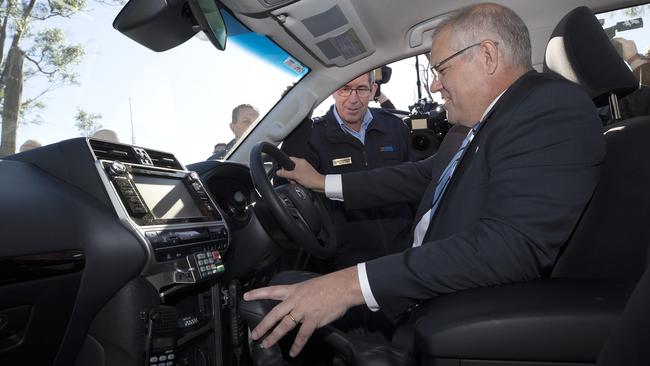 Prime Minister Scott Morrison meets SES Regional Officer North West Region Anthony Dick in Braddon at Parramatta Creek, Tasmania. PICTURE CHRIS KIDD