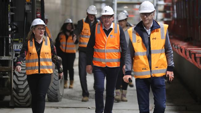 Daniel Andrews, centre, and minister Jacinta Allan tour the Arden Street train station site on Tuesday. Picture: David Crosling