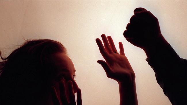 27/09/1996. Domestic violence. Silhouette. Fist raised against woman. Abuse. Generic image.