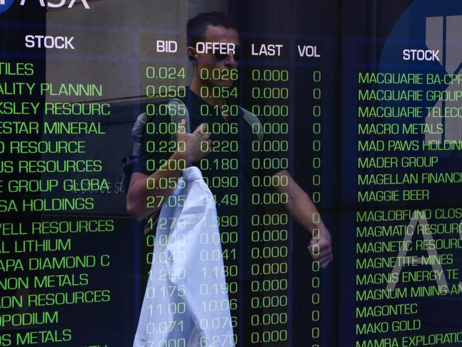 SYDNEY, AUSTRALIA - NewsWire Photos - APRIL 17 2023 -A general view of a person walking past the  Australian Stock Exchange at the ASX in central Sydney. Picture NCA NewsWire / Gaye Gerard