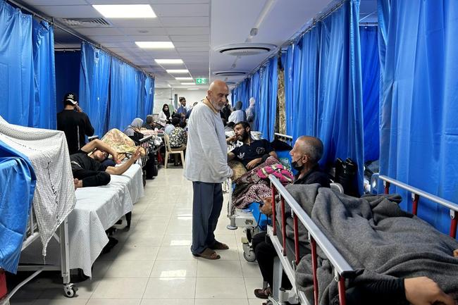 Patients and internally displaced line the halls at Al-Shifa hospital in Gaza City