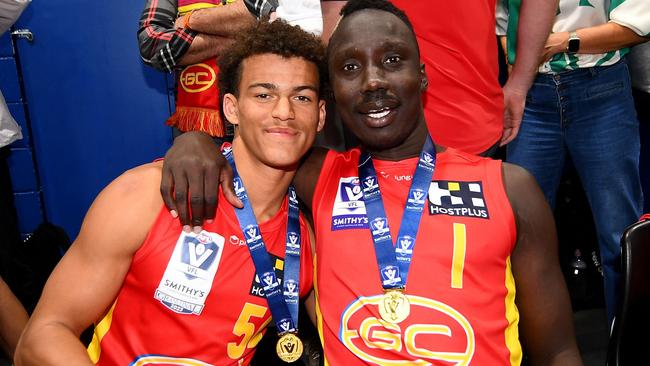 Leonardo Lombard and Mabior Chol of the Suns celebrate following the 2023 VFL premiership. Picture: Morgan Hancock/AFL Photos.