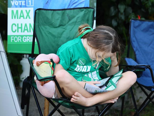 Natalie, 8, a young volunteer, rests in Bulimba. Picture: NewsWire/Tertius Pickard