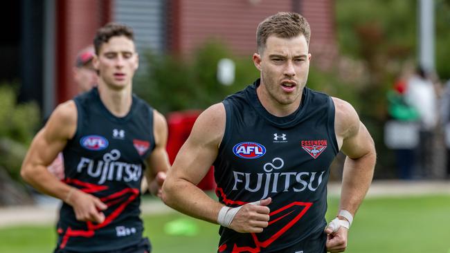 Essendon captain Zach Merrett (right) says the Bombers are intent on closing the gap on the top eight sides which he hopes is narrower than what results at the end of last season suggested. Picture: Jake Nowakowski