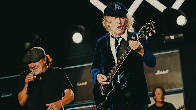 AC/DC members Brian Johnson, left, Angus Young, centre, and Stevie Young, right, perform at the Power Trip music festival in California on Saturday. Picture: Twitter / @Powertriplive