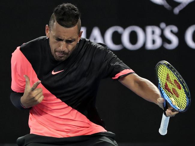 Australia's Nick Kyrgios celebrates after defeating France's Jo-Wilfried Tsonga during his third round match at the Australian Open tennis championships in Melbourne, Australia, Friday, Jan. 19, 2018. (AP Photo/Dita Alangkara)