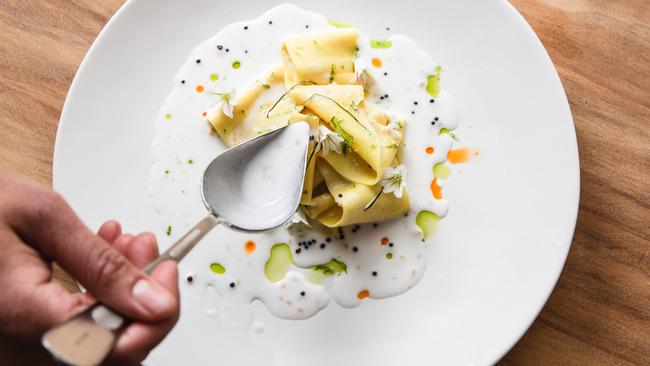 The signature dish khandvi, with besan, coconut, basil, bush tomatoes.