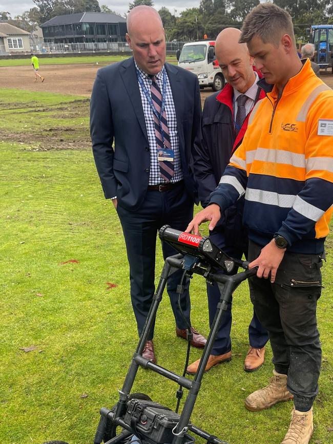 Brighton Grammar staff search the area with a ground penetrating radar machine.