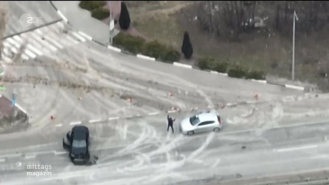 The man gets out of his car with his hands up. Picture: ZDF FRONTAL