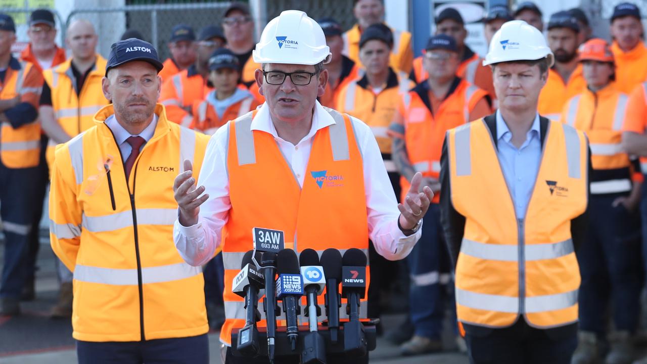 Victorian Premier Daniel Andrews (middle) and Roads and Road Safety Minister Ben Carroll (right) Ben Carroll in Dandenong on Thursday. Picture: NCA NewsWire / David Crosling