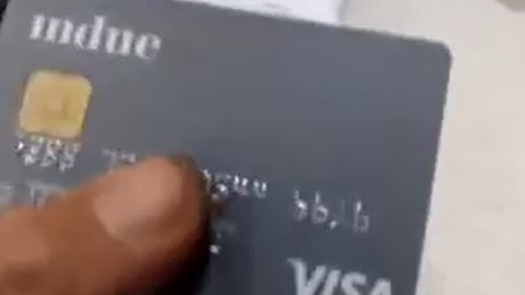 A cashless debit card being used.