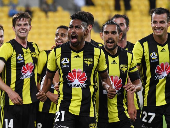 Roy Krishna of the Phoenix (centre) celebrates his goal against the Brisbane Roar FC during the Round 9 A-League match between Wellington Phoenix and Brisbane Roar at Westpac Stadium in Wellington, New Zealand, Saturday, December 22, 2018. (AAP Image/SNPA, Ross Setford) NO ARCHIVING, EDITORIAL USE ONLY