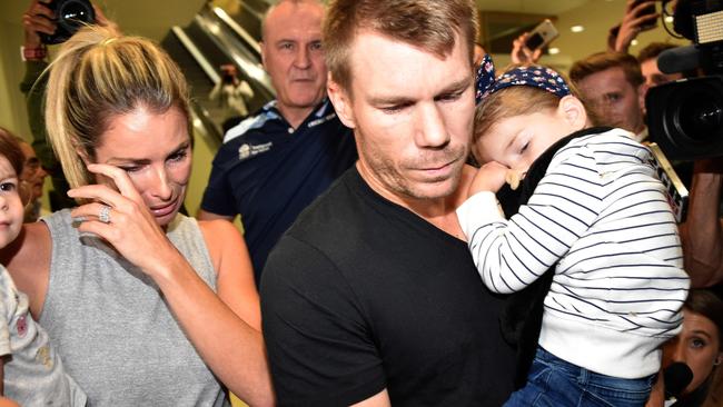 Candice and David Warner with their daughters, arriving back in Sydney from South Africa in March. (Pic: Peter Parks)