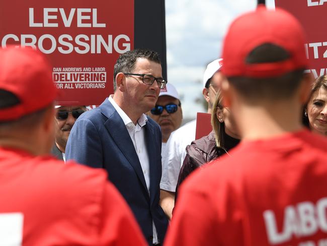 Victorian Premier Daniel Andrews (second left) and  Marlene Kairouz (right) are seen with Labor party supporters wearing red shirts at Deer Park train station in Melbourne, Thursday, November 22, 2018. Victorians go to the polls on Saturday. (AAP Image/Julian Smith) NO ARCHIVING