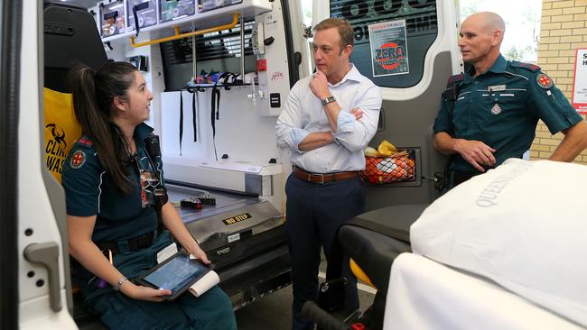 Health Minister Steven Miles (centre, with paramedics L-R Arquita Daly and Troy Newton) says upgrades to the Redland Hospital emergency department meant ambulances could be back on the road faster after delivering a patient to hospital. Picture: AAP/Jono Searle