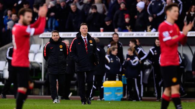 Manchester United manager Louis Van Gaal (c) reacts after the loss.