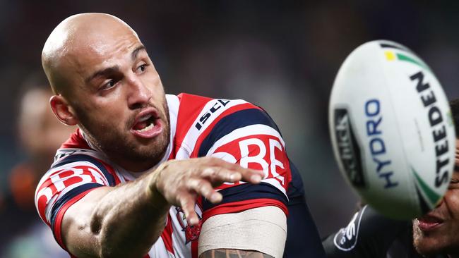 SYDNEY, AUSTRALIA - JUNE 03: Blake Ferguson of the Roosters offloads the ball in a tackle during the round 13 NRL match between the Sydney Roosters and the Wests Tigers at Allianz Stadium on June 3, 2018 in Sydney, Australia. (Photo by Matt King/Getty Images)