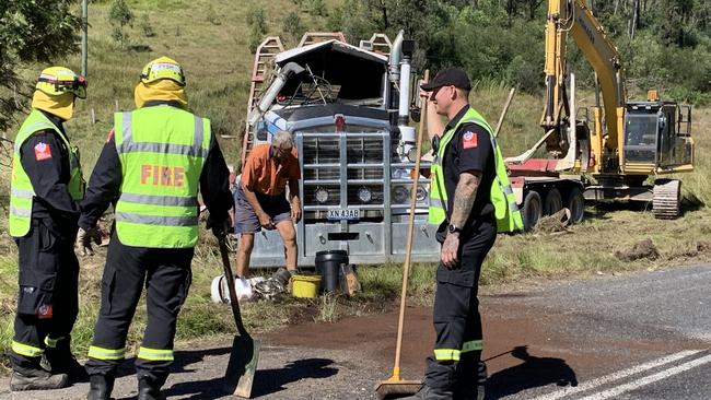 Hazmat mitigation by South Grafton Fire and Rescue team members after a Greensill Bros truck driver had a lucky escape when his log truck rolled west of Grafton on April 20.