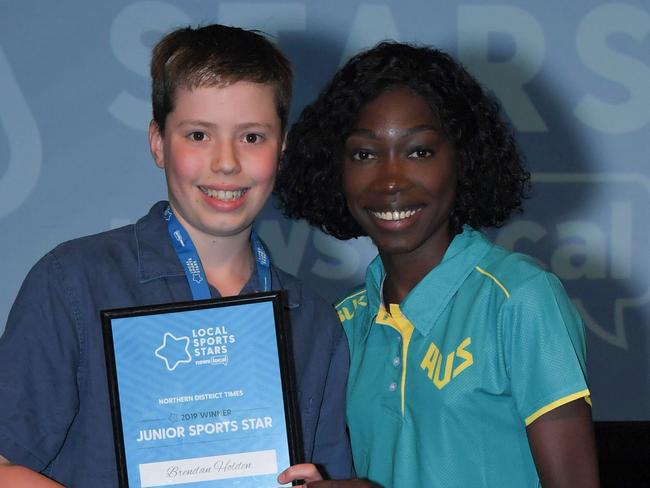 Newslocal Sports Star Awards at Bankstown Sports Club Wednesday October 23, 2019. Brendan Holden, Swimming - 2019 Junior Sports Star Winner for Northern District Times presented by 2017 JSS Winner, Bendere Oboya.(AAP IMAGE/Simon Bullard)