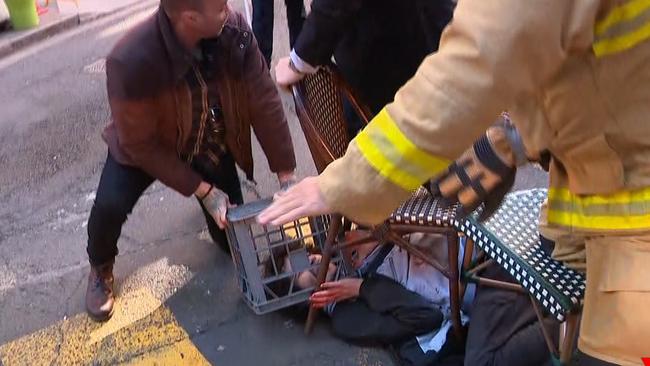 Ney is brought down by bystanders, police and emergency services. Picture: Seven News