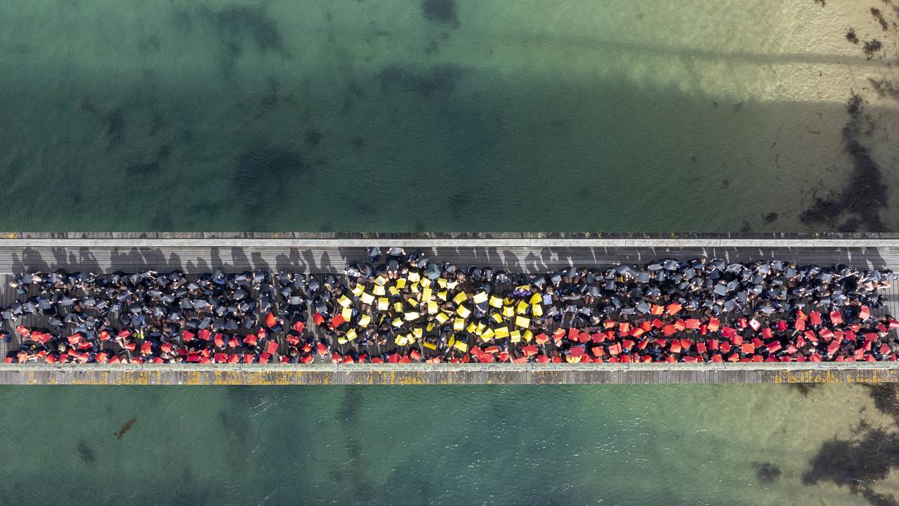 Barwon Heads Primary School students made an impressive sight from above when they gathered on the town's bridge to recognise National Reconciliation Week on Wednesday. Picture Supplied