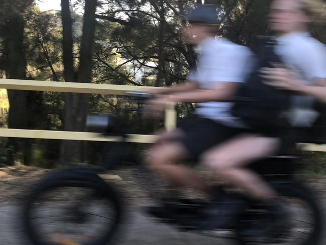 Secondary schools students on an e-bike on Pittwater Rd, Manly. Picture: Abby  O'Rourke