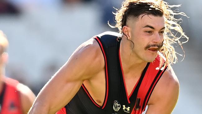 Essendon ruckman Sam Draper was fined $2000 for a punch to Geelong’s Esava Ratugolea.