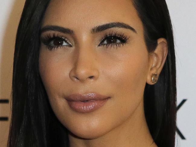 FILE - In this April 15, 2015, file photo, Kim Kardashian attends a photocall to launch hair products in Paris. An appearance by Kim Kardashian on the National Public Radio show "Wait Wait ... Don't Tell Me!" has angered some listeners. Some have threatened to stop donating to the nonprofit NPR. (AP Photo/Jacques Brinon, File)