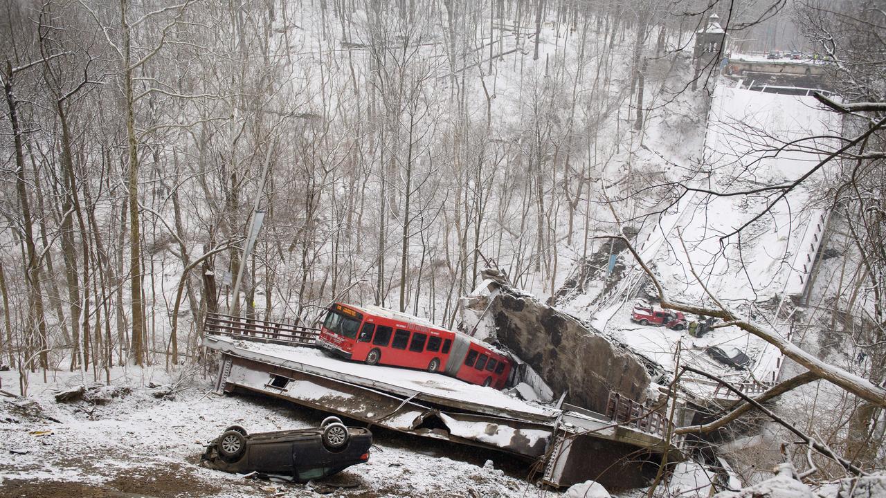 Vehicles including a Port Authority bus are left stranded after a bridge collapsed in Pittsburgh, Pennsylvania. Picture: AFP