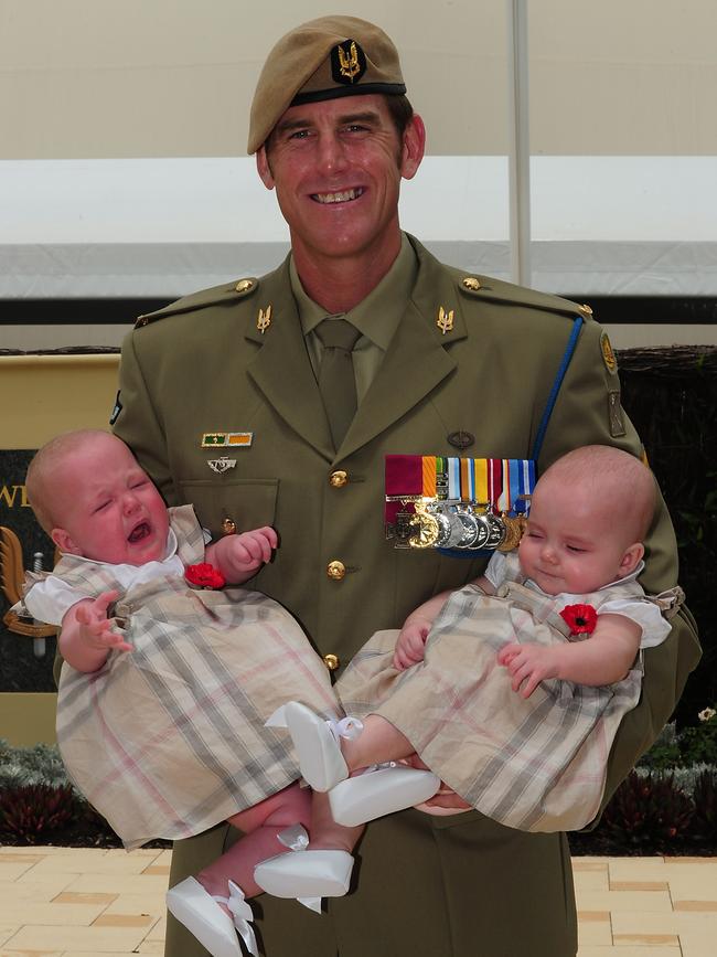 Ben Roberts-Smith with his daughters after receiving his Victoria Cross. Picture: CPL Chris Moore