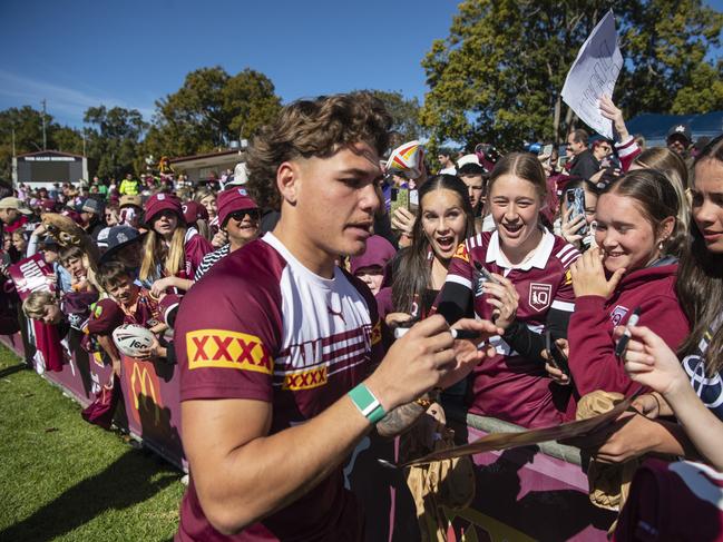 Fans get the autograph of Reece Walsh. Picture: Kevin Farmer