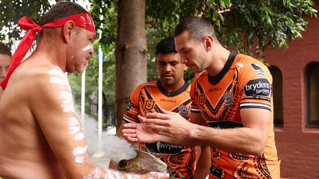 Brent Naden (R) and Tyrone Peachey take part in a smoking ceremony at National Centre of Indigenous Excellence. Picture: Mark Metcalfe/Getty