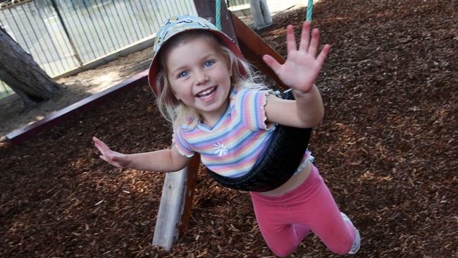 Marley, pictured having fun on the swings, is one of the many kids at Belmont Community Kindergarten benefiting from its high rating as a centre. Picture: Alan Barber